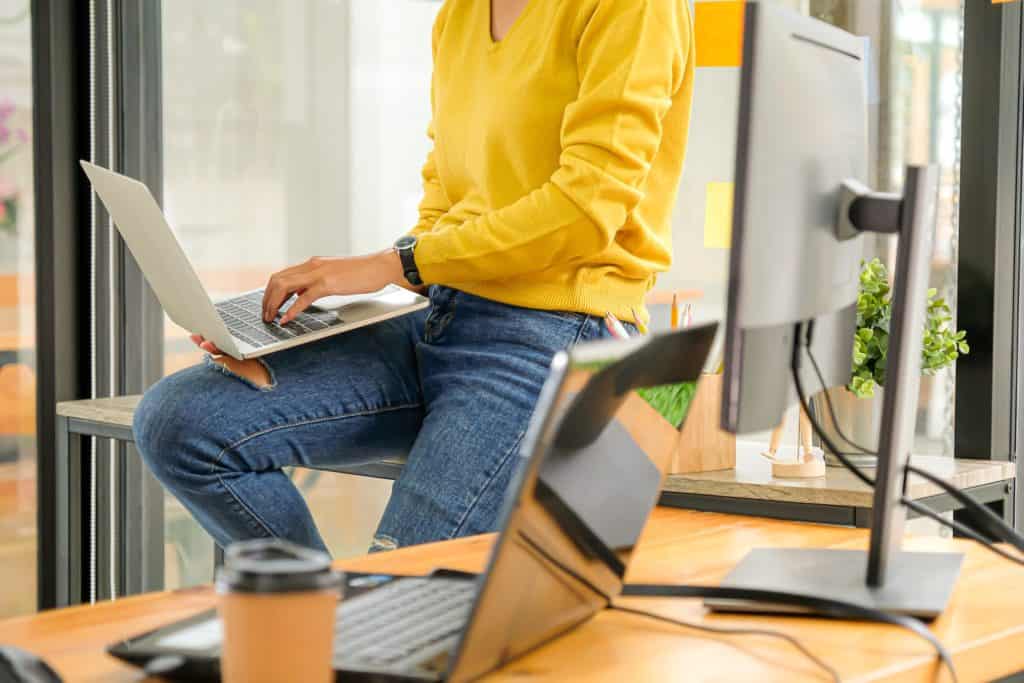 Programmers are using laptops to test the system in the office.